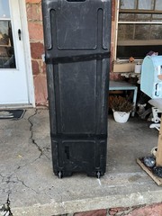 Large Black Plastic Audio Equipment Case with Wheels, Carry Handle, and Strap
