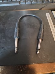 1/4-inch (6.35 mm) mono TS (Tip-Sleeve) 10″ patch cable